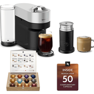 Nespresso coffee maker with a frother, two prepared drinks, a variety box of capsules, and a card offering redemption for 50 complimentary capsules.