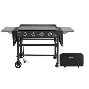 A large, black 4-burner gas griddle with foldable side shelves and wheels, accompanied by a protective cover.