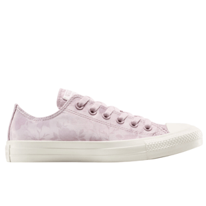 A low-top sneaker in pale pink with a subtle floral pattern and white sole, featuring lace-up closure and a classic rubber toe cap design.