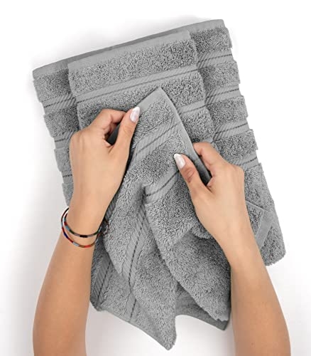 A set of gray Turkish cotton towels with varying textured patterns is being displayed; the towels appear soft and plush.
