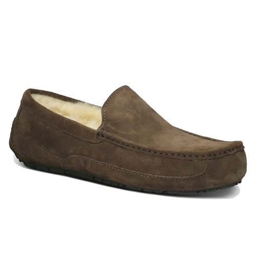 UGG Men's Slippers are brown suede moccasin-style loafers with a cozy, faux fleece lining and a sturdy sole.