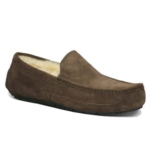 UGG Men's Slippers are brown suede moccasin-style loafers with a cozy, faux fleece lining and a sturdy sole.