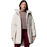 A woman is wearing a light-colored winter coat with a high collar over a mauve turtleneck and maroon leggings.