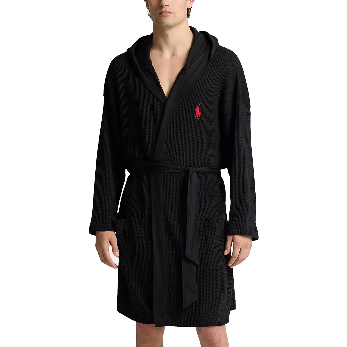 A black waffle-knit bathrobe with a hood and a red embroidered logo on the chest, featuring front pockets and a waist belt.