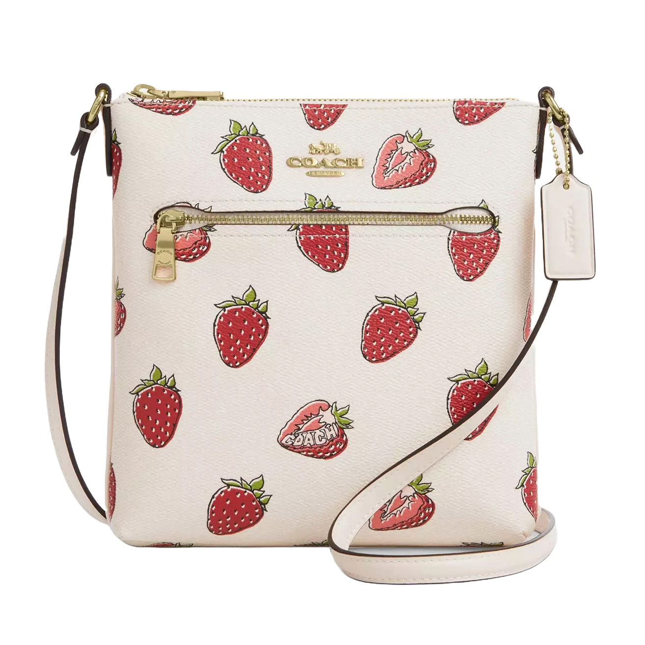The Coach Outlet Rowan Crossbody features a playful strawberry print on a white background, with a gold zipper pocket, Coach logo, and a detachable tag. The bag includes an adjustable strap for easy carrying.
