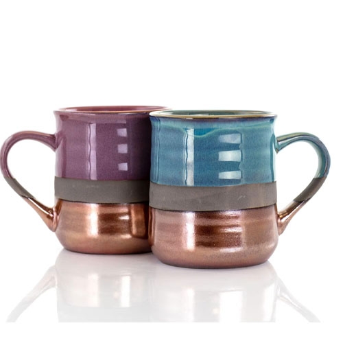 two copper bottom mugs, one purple and one blue