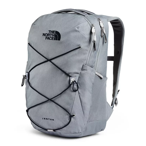 This is a light gray The North Face Jester backpack featuring a flexible bungee cord system on the front, multiple zippered compartments, and breathable mesh panels on the shoulder straps and back.