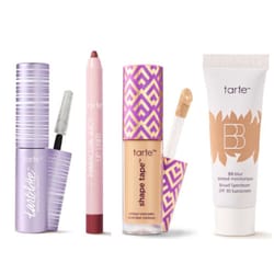 A collection of Tarte cosmetics featuring Lash Paint mascara, Maracuja juicy lip liner, Shape Tape contour concealer, and a BB blur tinted moisturizer with SPF 30.