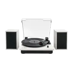 White turntable with a transparent dust cover and black vinyl record, flanked by two black and white speakers.
