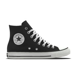 Black high-top sneaker with white laces and a classic circular logo on the inner ankle.