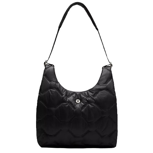 A black quilted shoulder bag with a padded strap and a central round logo detail, featuring a spacious design.