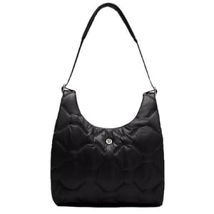 A black quilted shoulder bag with a padded strap and a central round logo detail, featuring a spacious design.