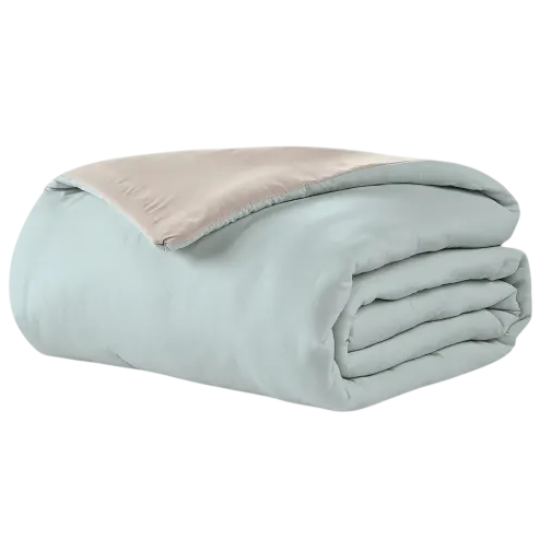 A folded, reversible blanket with one side in light blue and the other in beige.