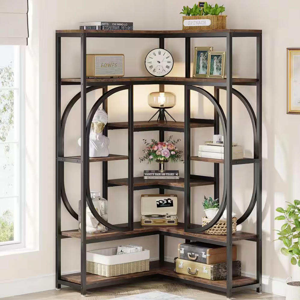A wooden and metal shelving unit with various decorative items including books, plants, a clock, a lamp, and suitcases.