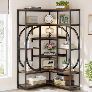 A wooden and metal shelving unit with various decorative items including books, plants, a clock, a lamp, and suitcases.