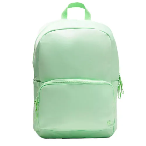 A light green backpack with a large main compartment, a smaller front pocket, and a top handle.