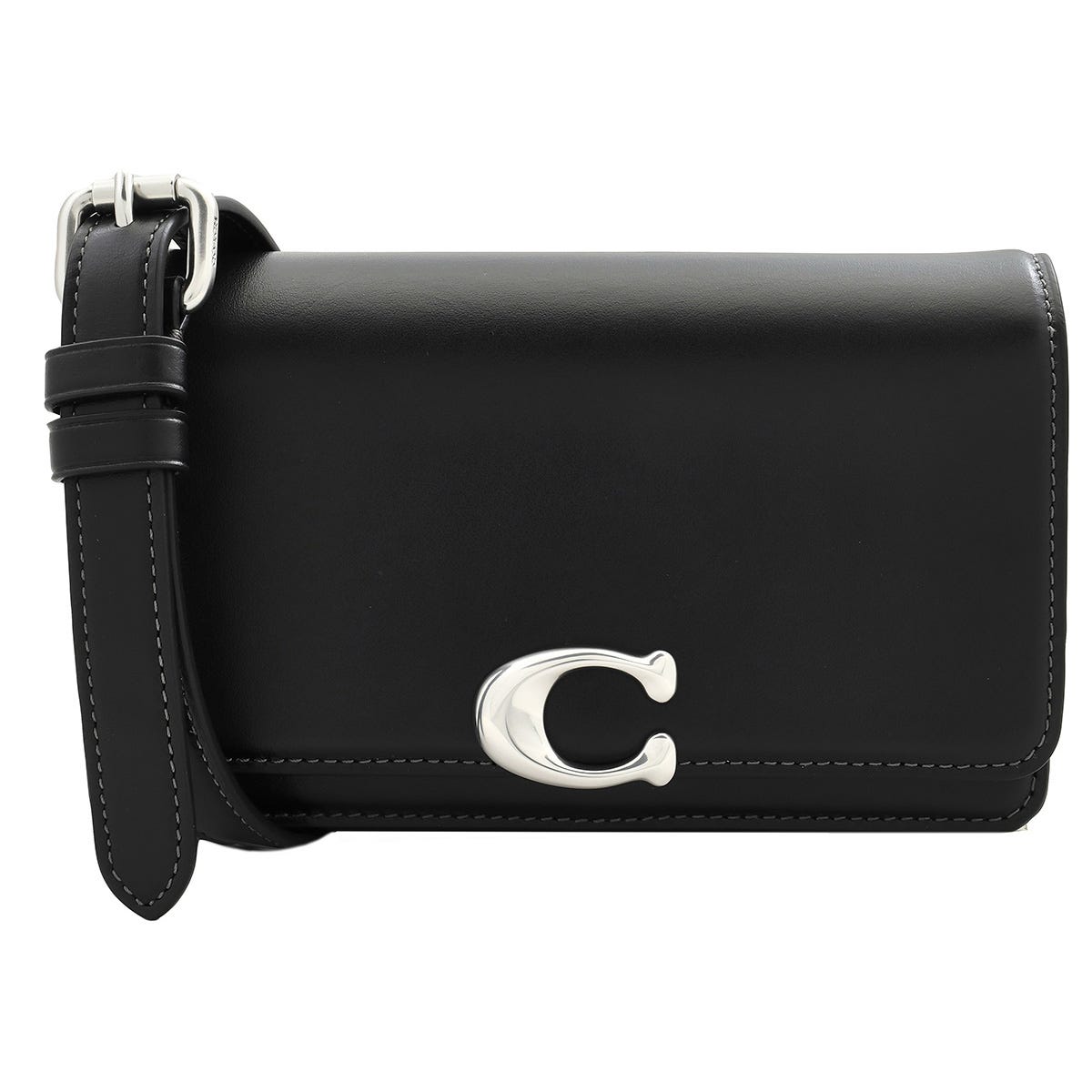 A black Coach Leather Bandit Fanny Pack features a silver \“C\“ logo on the front flap and a sleek, adjustable strap, highlighted with white stitching for a classic look.