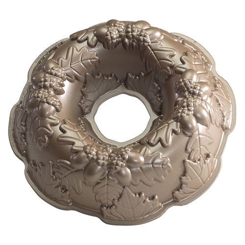 A decorative Bundt cake pan featuring intricate leaves and acorn designs.