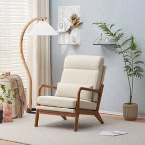 A beige cushioned armchair with a minimalist design features a solid wood frame and angled legs, offering both comfort and style.