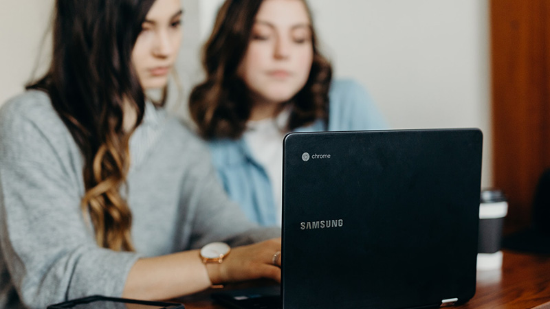 women looking at laptop