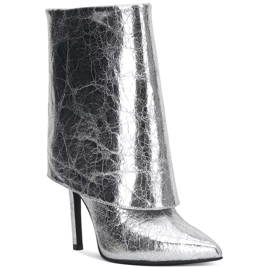 A high-heeled, silver metallic boot with a cracked texture and pointed toe design.