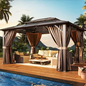 A gazebo with draped curtains and a seating area is set on a wooden deck beside a pool, surrounded by tropical plants and mountains in the background.