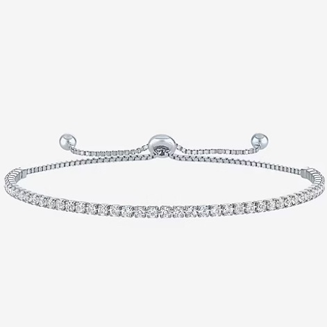 Silver bracelet with a single row of clear gemstones and adjustable closure.
