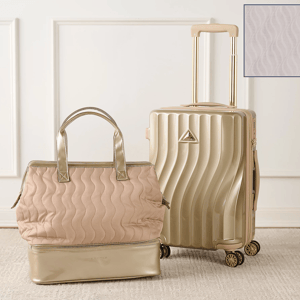 A wavy-textured cream-colored suitcase with dual spinner wheels is paired with a matching quilted tote bag featuring a metallic base and handles.