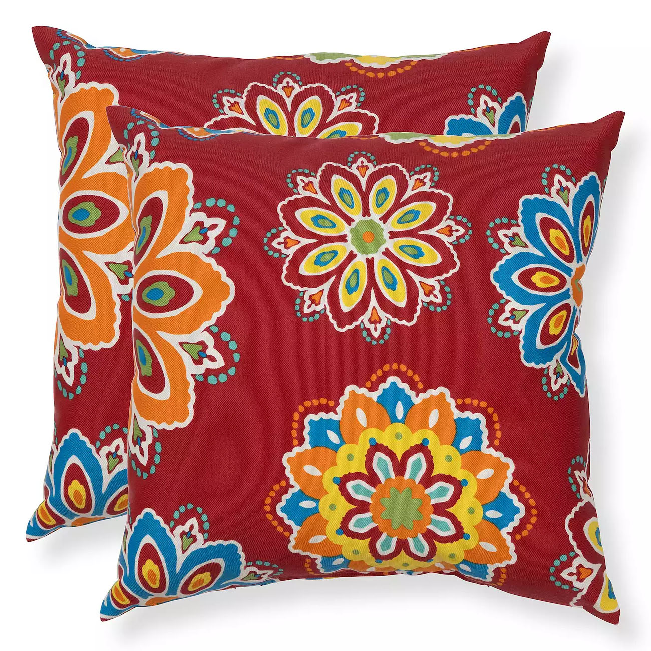 Two decorative pillows featuring a vibrant, multicolored floral pattern on a red background.