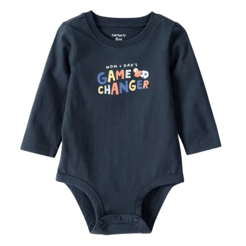 A navy blue long-sleeve baby onesie with the text \“Mom + Dad's Game Changer\“ printed in multicolored letters. It features snap closures at the bottom for easy diaper changes and is size 6 months.