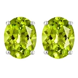 Oval-shaped green gemstones set in a simple stud earring design with four-prong settings.