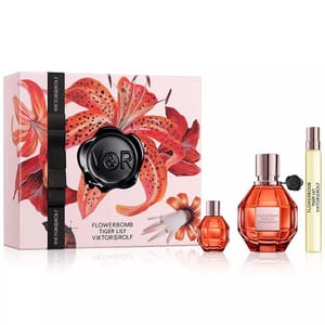 Viktor&Rolf Flowerbomb Tiger Lily set includes a large and small perfume bottle alongside a travel-sized spray. The packaging features a vibrant tiger lily design.