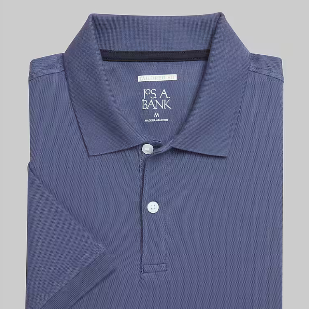A blue Jos. A. Bank polo shirt with a collar and a two-button placket, labeled as size medium and made in Mauritius.