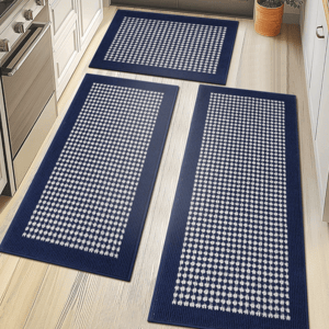 Three rectangular blue and white checkered rugs are displayed on a light wood floor in a kitchen setting.