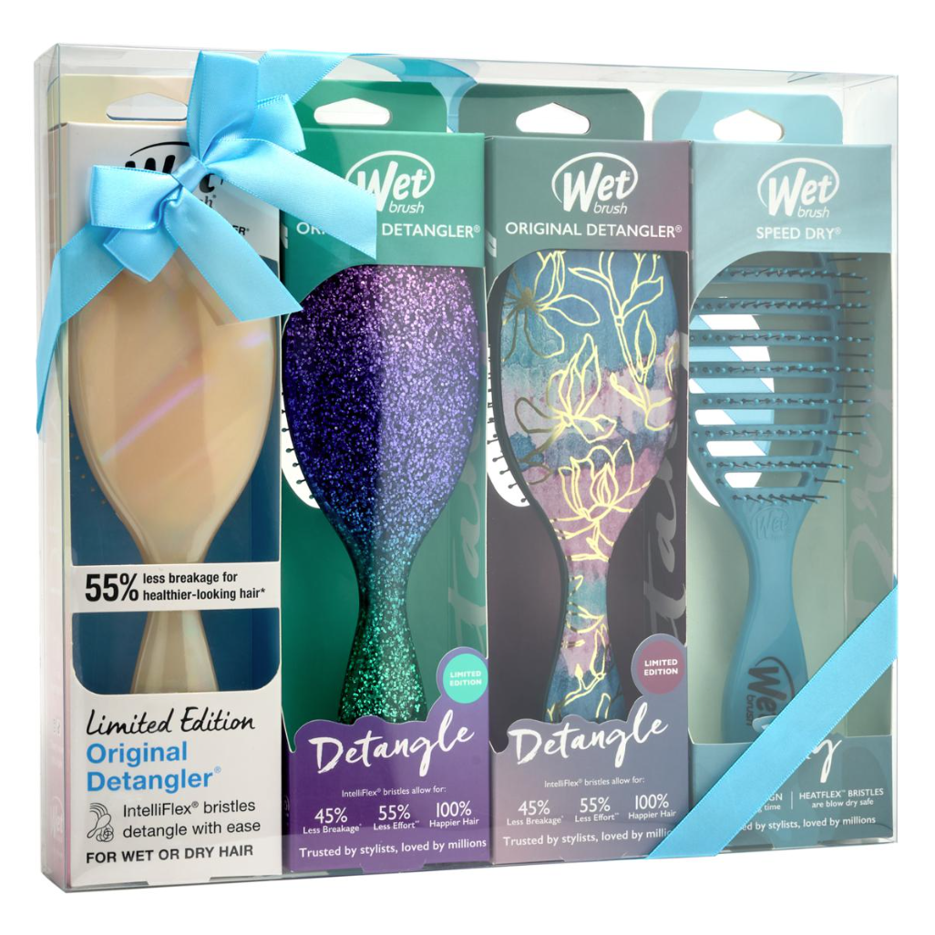 A gift set featuring Wet Brush hair tools, including limited edition Original Detangler brushes with IntelliFlex® bristles for reduced breakage and a Speed Dry brush, all adorned with a decorative design and tied with a blue ribbon.