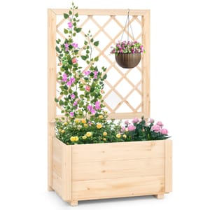 A wooden raised planter features a built-in lattice trellis, showcasing pink climbing flowers, yellow and pink roses, and a hanging basket with purple flowers.