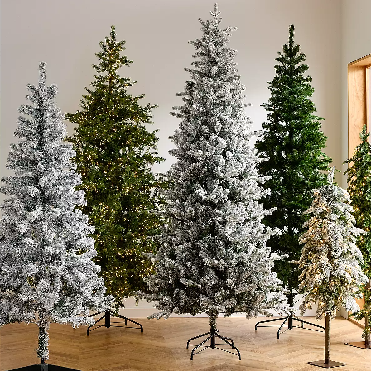 6' pre-lit flocked Christmas tree with a snowy appearance and integrated lights for easy setup and a festive look.