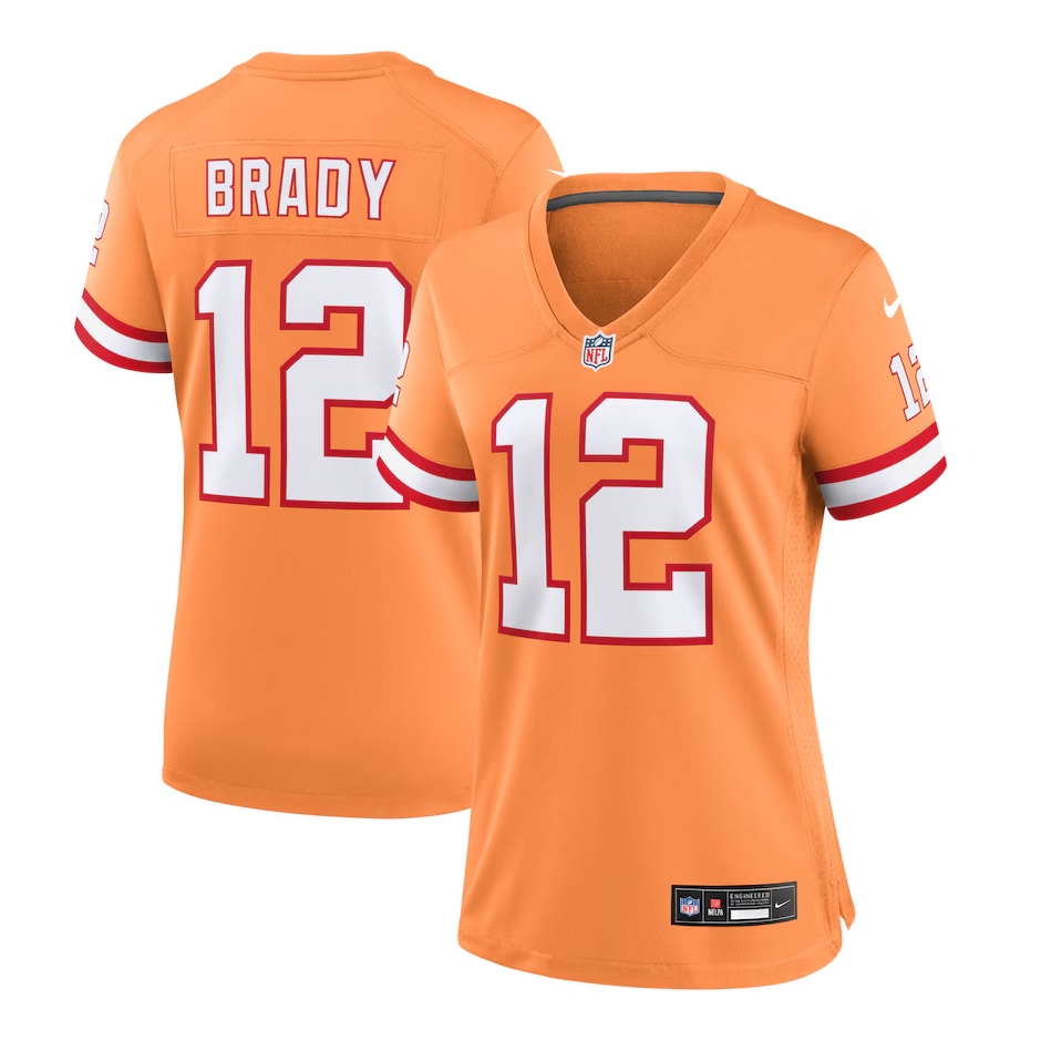 Orange NFL jersey with \“Brady\“ and number 12, featuring red and white stripes on the sleeves, Nike branding, and an NFL logo on the chest.