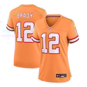 Orange NFL jersey with \“Brady\“ and number 12, featuring red and white stripes on the sleeves, Nike branding, and an NFL logo on the chest.