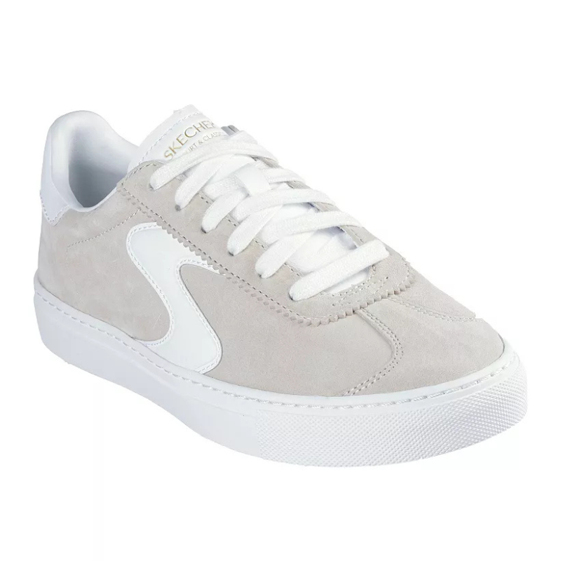 Skechers Suede Sneakers feature a light gray suede upper with white detailing, including a side stripe and laces. They have a smooth white rubber sole, providing a clean and classic look.