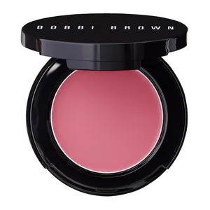 Bobbi Brown cream blush in a pink shade, displayed in an open black compact with the brand name on the lid.