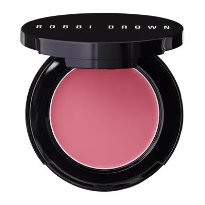 Bobbi Brown cream blush in a pink shade, displayed in an open black compact with the brand name on the lid.