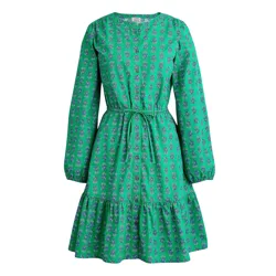 Green long-sleeve dress with a floral pattern, featuring a round neckline, gathered waist with a tie, and a tiered skirt.
