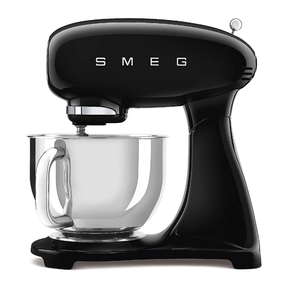 A black SMEG stand mixer with a stainless steel mixing bowl.