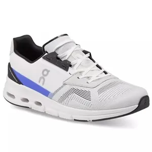 White athletic shoe with black and blue accents, featuring a distinctive sole design and ventilation patterns on the upper.