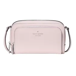 A Kate Spade New York pink crossbody bag with a front zip pocket, featuring the brand logo in the center and adjustable strap.