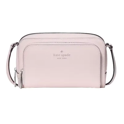 A Kate Spade New York pink crossbody bag with a front zip pocket, featuring the brand logo in the center and adjustable strap.