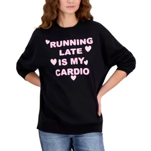 A black sweatshirt with pink text saying \“Running Late is My Cardio\“ includes decorative hearts. The person wearing it also has blue jeans on.
