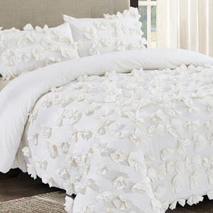 White queen comforter set with 3D floral texture, featuring soft, fabric flowers covering the surface. Includes matching pillow shams for a cohesive look.