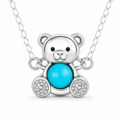 A teddy bear pendant necklace featuring a turquoise-colored body and sparkling accents on a silver chain.